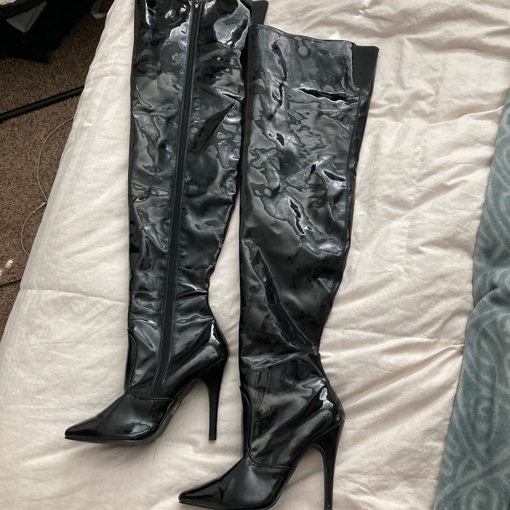 Shiny thigh high plastic heeled boots